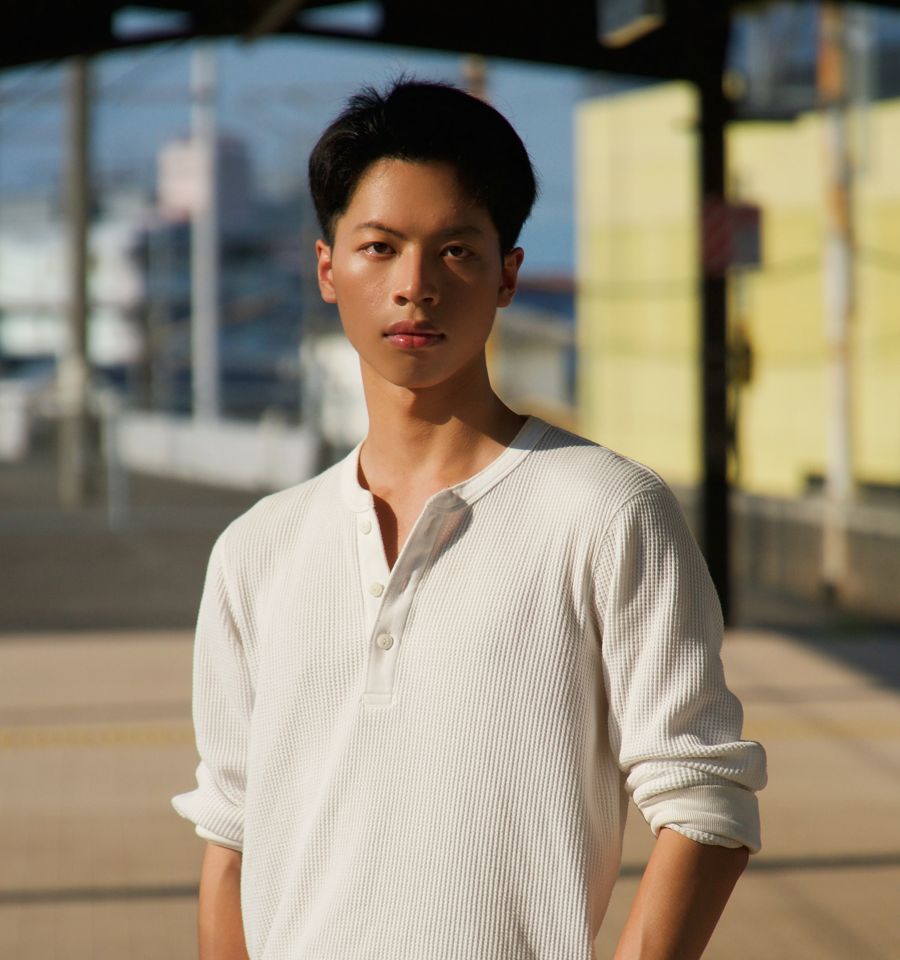 Pann Phetra on a train platform in Japan
