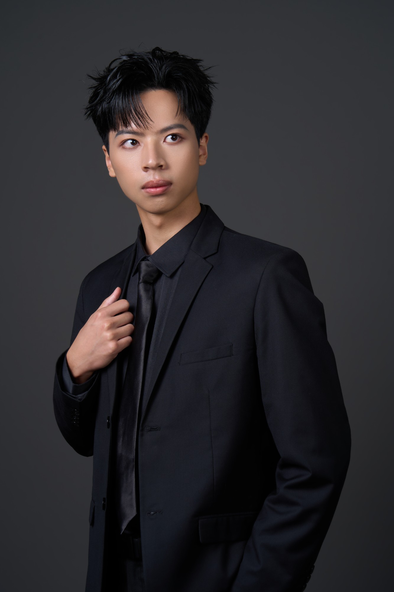 Portrait of Pann Phetra in a black suit